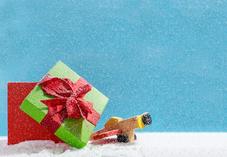 Christmas holiday concept with wooden toy and giftの写真素材
