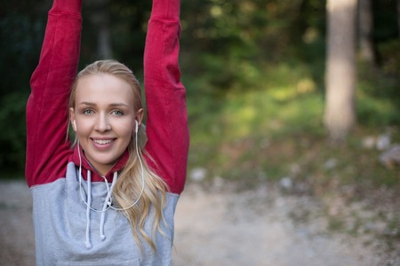 Blonde woman running outsideの写真素材