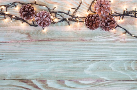 Xmas or new year composition with holiday decoration -on wooden background. Xmas card. Space for textの写真素材