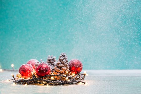 Christmas decorations with candles and pine cornの写真素材