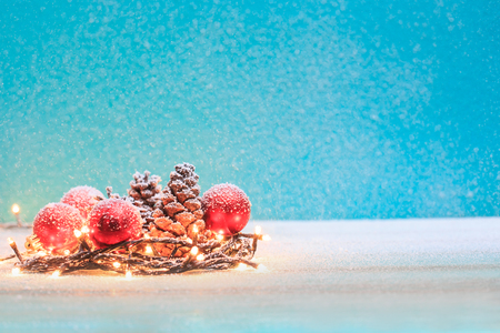 Christmas decorations with candles and pine cornの写真素材