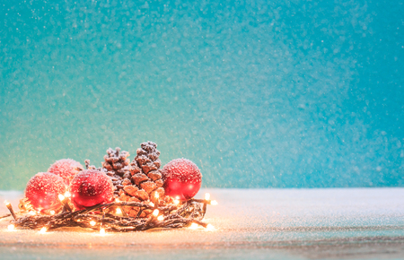 Christmas decorations with candles and pine cornの写真素材