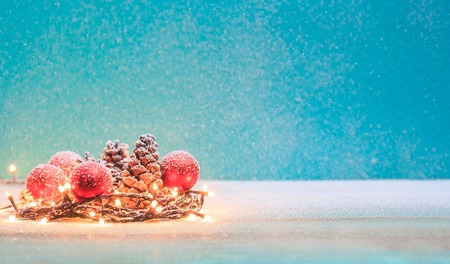 Christmas decorations with candles and pine cornの写真素材