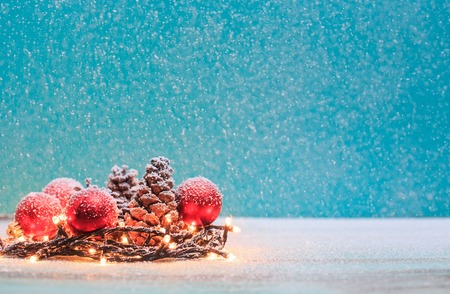 Christmas decorations with candles and pine cornの写真素材