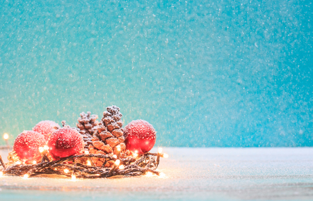 Christmas decorations with candles and pine cornの写真素材