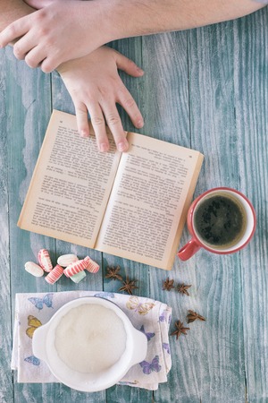 Top view of stuff table  coffee, phone, book, empty space, rustic tableの写真素材
