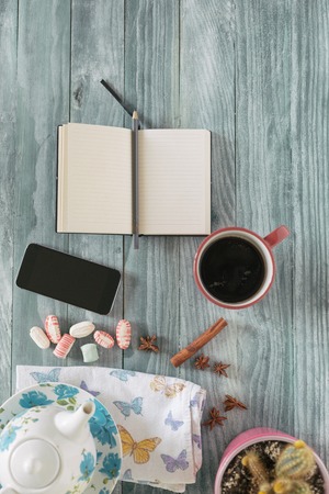 Photo blank book cover on textured wood background with cape of coffeeの写真素材