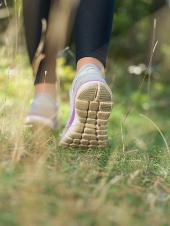 Runner feet running closeup on shoeの写真素材