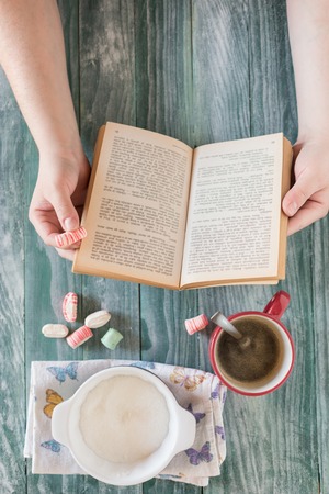 Top view of stuff table  coffee, phone, book, empty space, rustic tableの写真素材