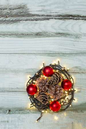 Nest with Christmas balls on rustic backgroundの写真素材