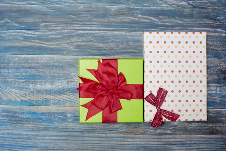 Christmas background with decorations and gift boxes on wooden boardの写真素材