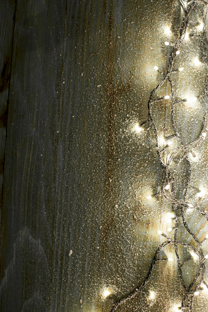 Christmas fir tree with decoration on a wooden boardの写真素材