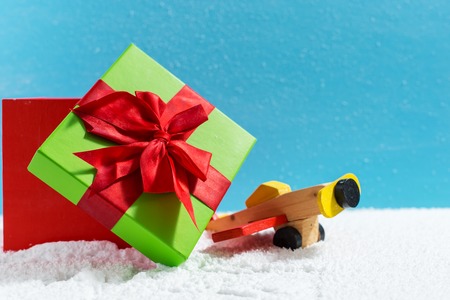 Christmas holiday concept with wooden toy and giftの写真素材