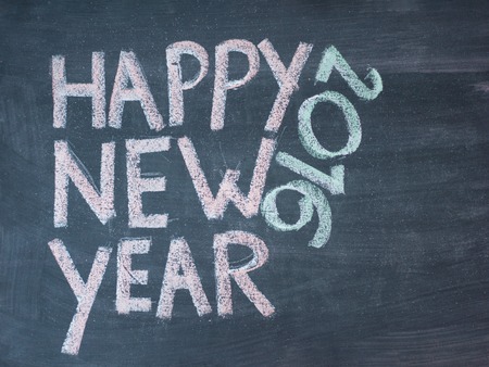 Happy new year 2016, hand writing with chalk on blackboard, vintage conceptの写真素材
