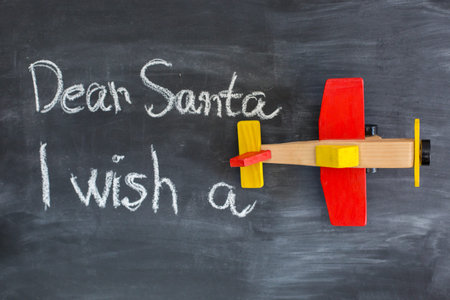Dear Santa is written on a blackboard and christmas decorationの写真素材