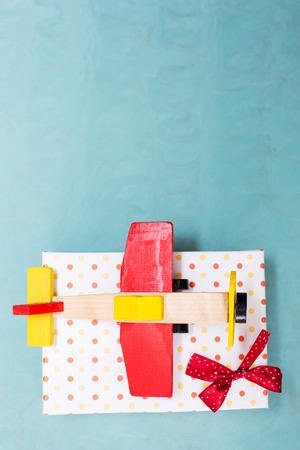 vintage wooden airplane against grunge background. Xmas holiday and winter vacation conceptの写真素材