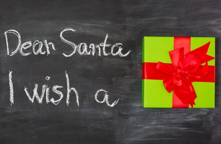 nostalgic home christmas decoration with antique toys. vintage arrangement and blackboard with sample text Dear Santaの写真素材