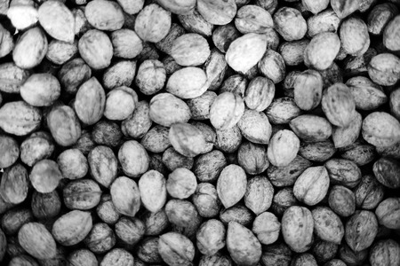 Walnut background, scattered pile of walnutsの写真素材
