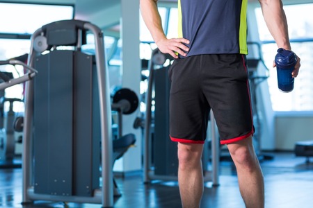 Portrait Of A Physically Fit Young Man In Modern Fitness Centerの写真素材
