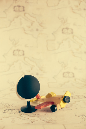 Globe and airplane toy with copy spaceの写真素材