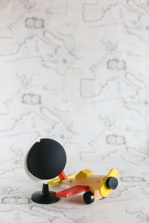 Globe and airplane toy with copy spaceの写真素材