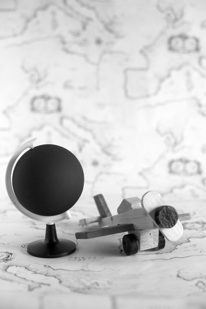 Globe and airplane toy with copy spaceの写真素材