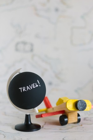 Globe and airplane toy with copy spaceの写真素材