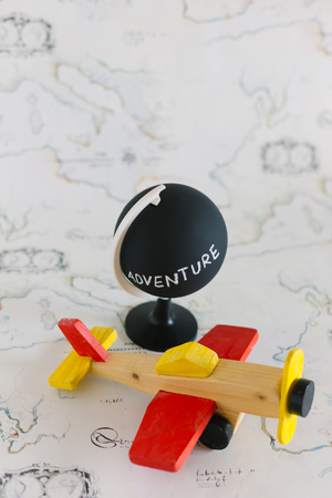 Globe and airplane toy with copy spaceの写真素材