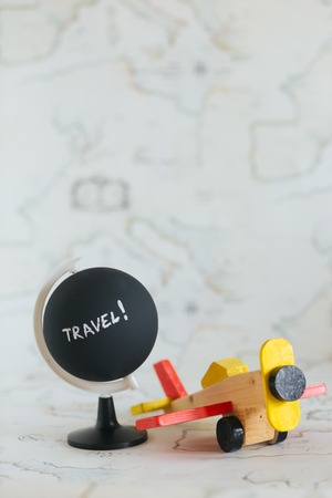 Globe and airplane toy with copy spaceの写真素材