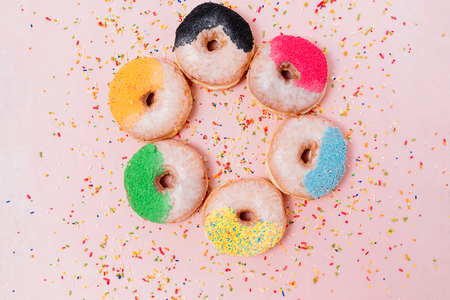 Assorted donuts on a pastel pink background, copyspaceの写真素材