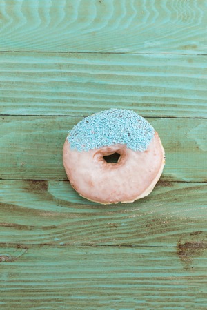 Donut on wooden backgroundの写真素材