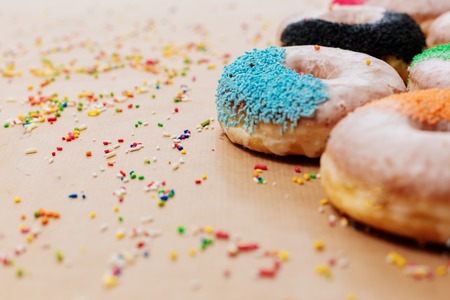 Colorful donuts on paper  backgroundの写真素材