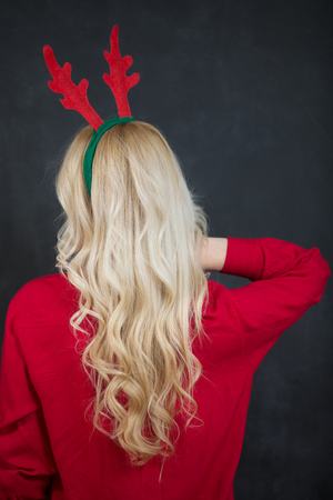 Beautiful blonde woman in Santa hatの写真素材