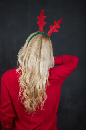Beautiful blonde woman in Santa hatの写真素材