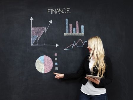business and finaces concept - smiling business woman presenting financialの写真素材