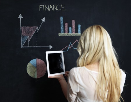 business and finaces concept - smiling business woman presenting financialの写真素材