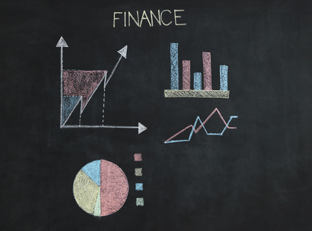 Financial graphs analysis on chalkboardの写真素材