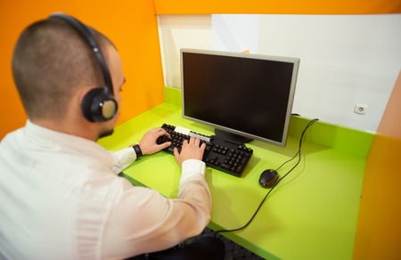 Assistant using a headset in a call centerの写真素材