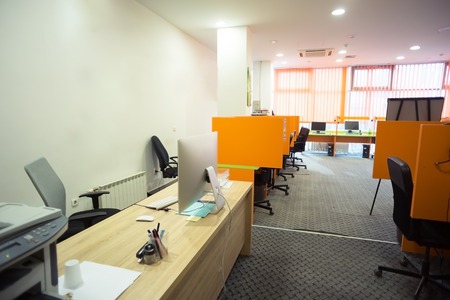 empty startup business office interior with modern computers and furnitureの写真素材