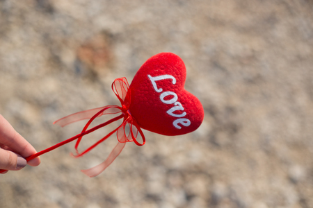 Red heart on exotic sandy beach - Valentine's day conceptの写真素材