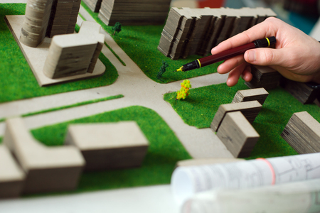 Architectural project./ Building model and drafting tools on construction plan.の写真素材