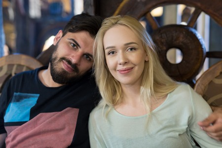 Young Couple Enjoying Meal In Outdoor Restaurantの写真素材