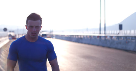 Running at sunrise man exercising for marathon and workout fitness