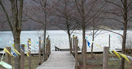 A Day At The Lake. Wooden dock overlooking a gorgeous lake in the wildernessの写真素材
