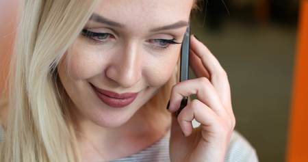 pretty businesswoman using smart phoneの写真素材