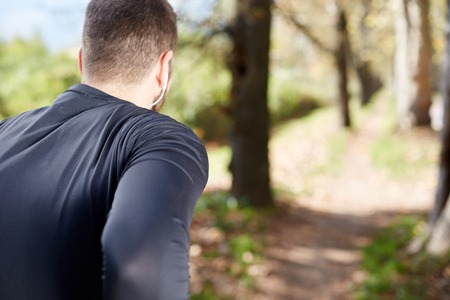 Runner doing stretching outside in autumnの写真素材