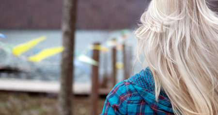 woman running on dock, close up of hairの写真素材