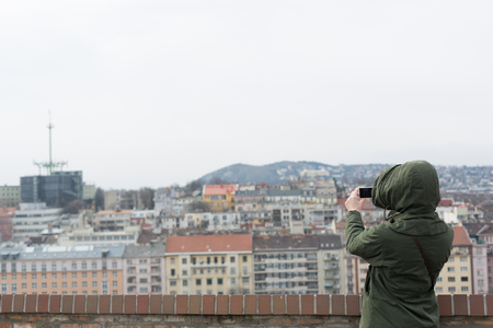 Beautiful young blonde tourist woman taking photographs.の写真素材