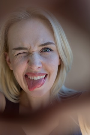 portrait of  joyful young student, portrait of blond womanの写真素材