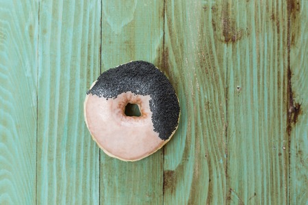 fresh donut on wooden table topの写真素材